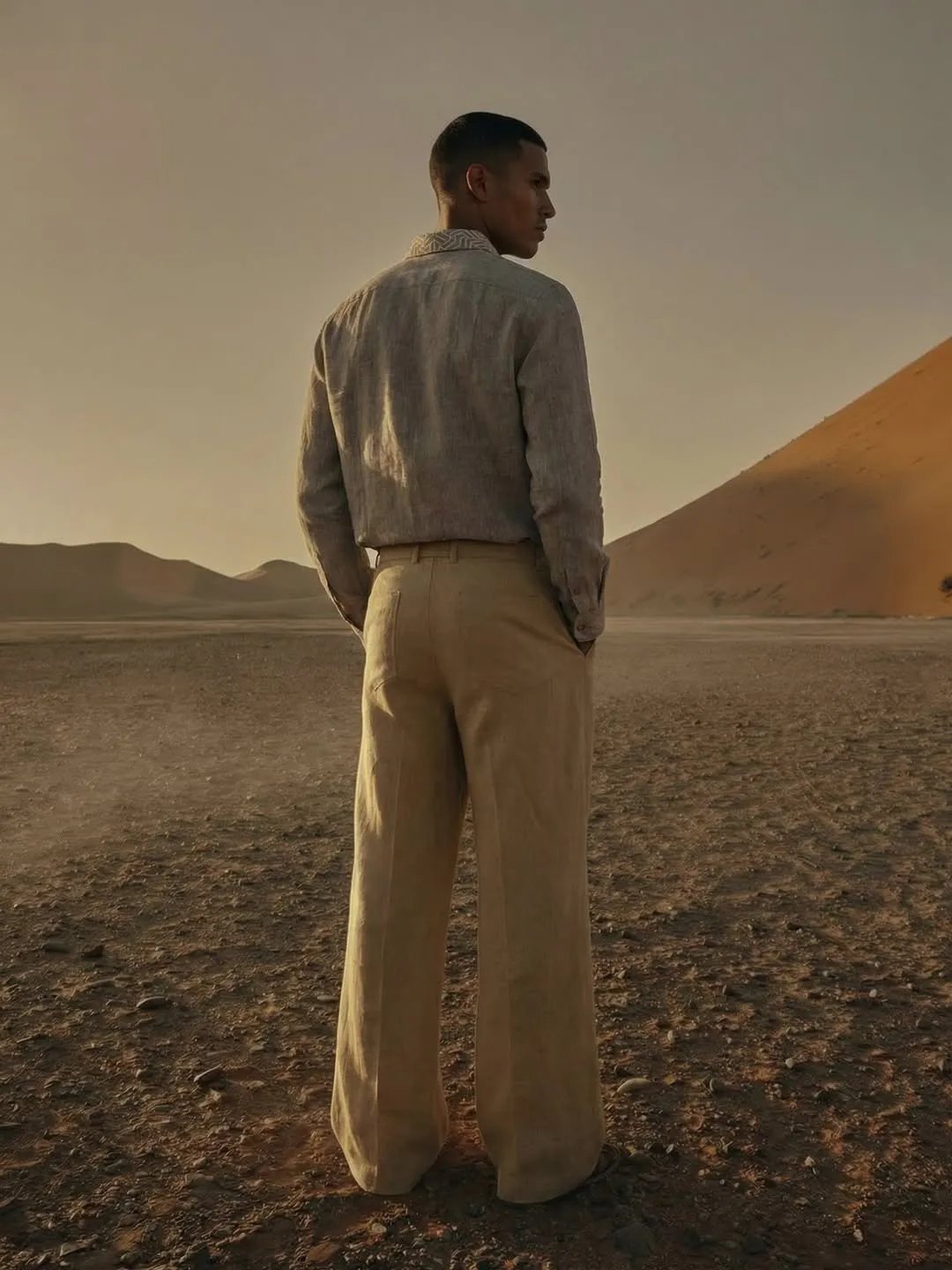 Back view of the linen look against desert dunes