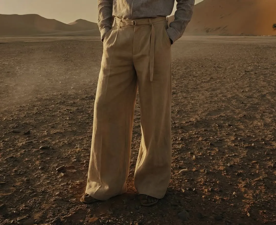 Wide-leg sand linen trousers with front pleats and a self-tie belt